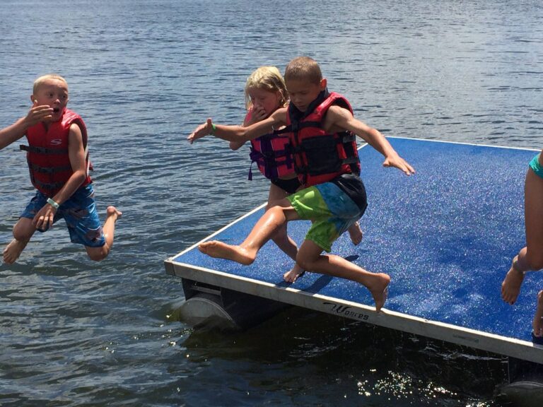 Kids jumping of raft image